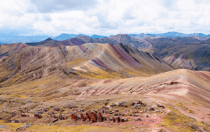 view third rainbow mountain surrounded by colorful landscape